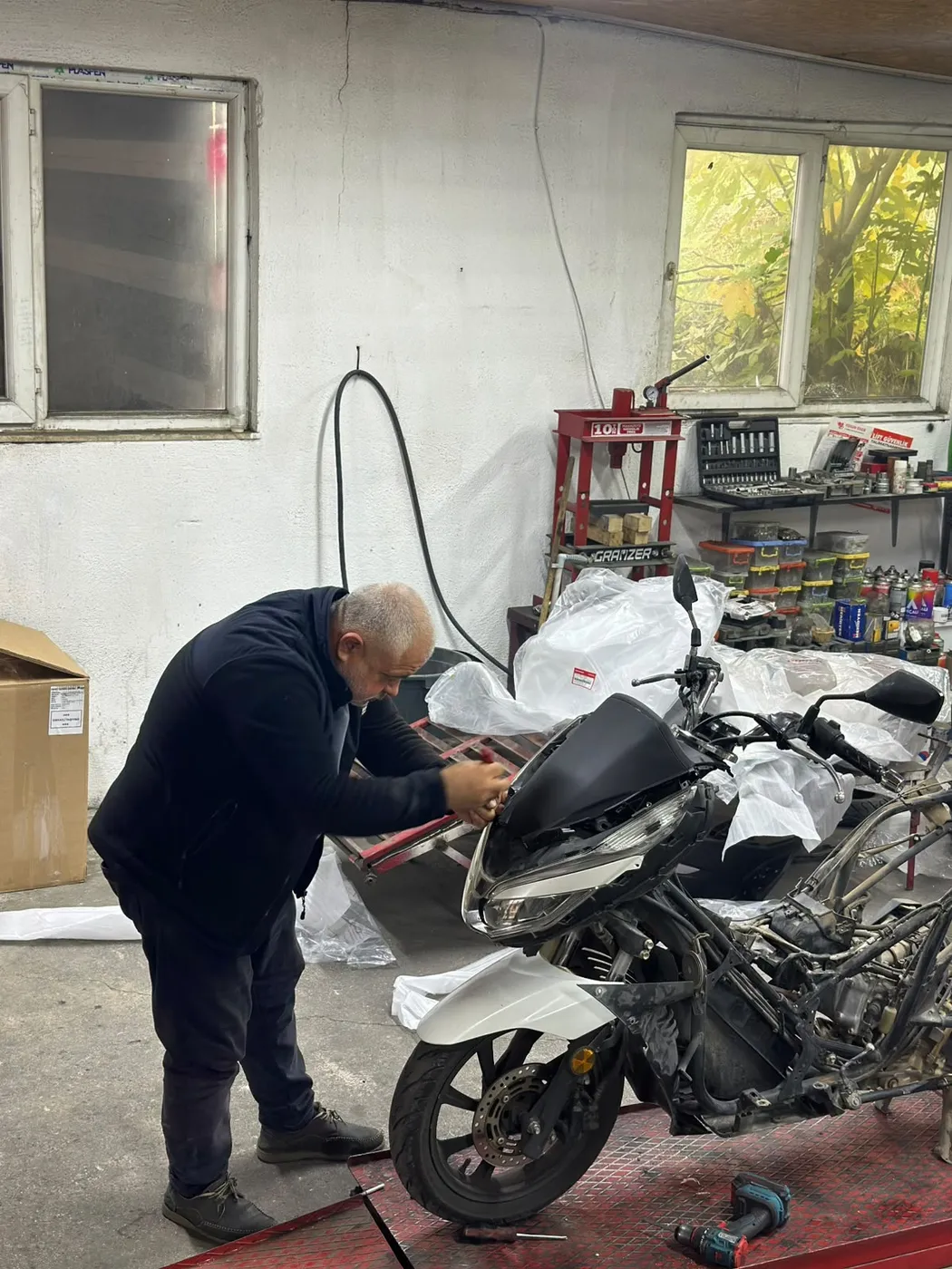Scooter front panel being prepared at Kral Motor workshop