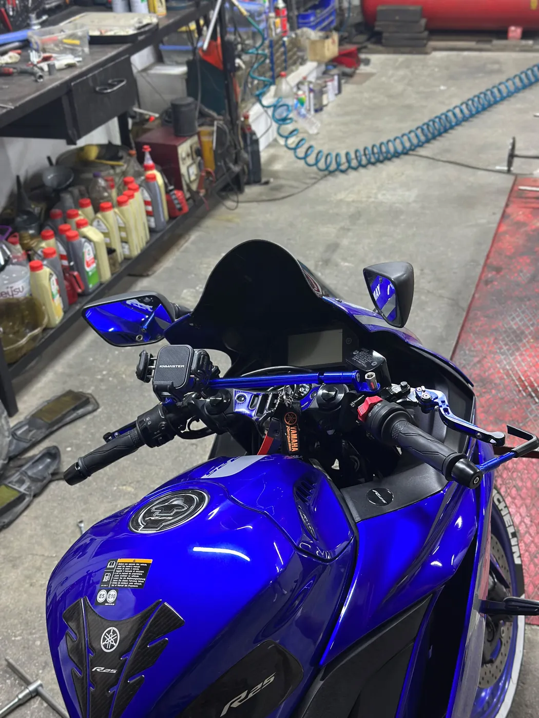 Handlebar accessory being fitted to a Yamaha R25 at Kral Motor