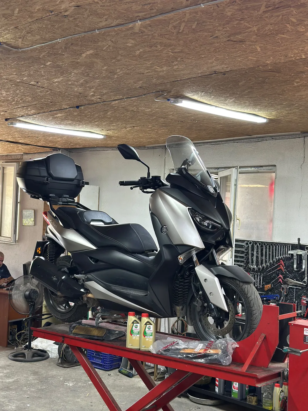 Yamaha X-Max on the lift at Kral Motor
